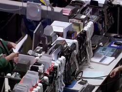 MS View of two men in stock exchange office calling on telephones / Chicago, Michigan, United States Stock Footage