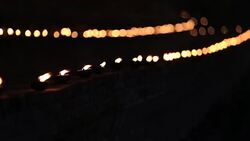 the light from the candle lit at night around wat maheyong Stock Footage