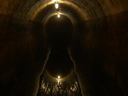 Sewage in a New York City sewage tunnel reflects overhead lights. Stock Footage