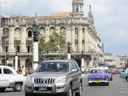 Traffic with old cars in front of Capitol building Havana Cuba Stock Footage