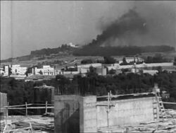 B/W 1967 long shot smoke rising after bombing in Six Day War / Jerusalem / newsreel Stock Footage