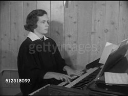 1952: ST. JOHN'S EVANGELICAL LUTHERAN CHURCH: ELKHORN: MCU Newspaper 'Christmas Day in Traditional Manner to be Observed...' VS 'St. John's Evangelical Lutheran Church' building, INT female playing organ, church choir singing carol First Noel (SOT). Instructional Video