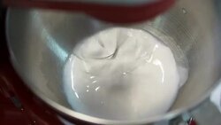 Mixing cream in mixing machine Stock Footage
