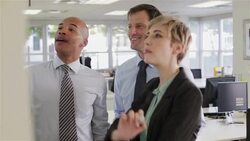 Business people having meeting at whiteboard Stock Footage