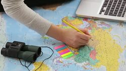 Young woman with a map planning a trip. Stock Footage