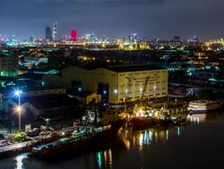 WS T/L View of Ho Chi Minh City docks and city at night / Ho Chi Minh City, Southeastern, Vietnam Stock Footage