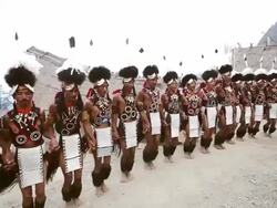 MS Shot of Naga tribesmen dancing in Hornbill Festival, Kisama / Kohima, Nagaland, India Stock Footage
