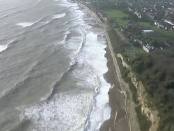 Aerials of Waves Crashing on Bournemouth Coastline News Clip
