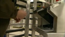 A construction worker scans his card and places his palm on an identification machine. Stock Footage