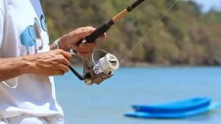 Hands on fishing rod Stock Footage