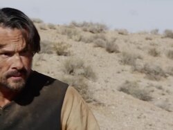 Up close view of man turning to shoot his pistol in a gunfight. Stock Footage