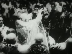 1936: BRITISH MONARCHY: VS Coronation of George VI (Edward VIII brother), Archbishop of Canterbury placing crown, family on balcony: Queen consort Elizabeth Bowes-Lyon, daughters Elizabeth II, Margaret, Queen consort Mary of Teck, King George VI. Instructional Video