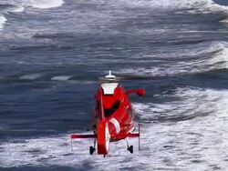 AERIAL Coast Guard helicopter flying over ocean, Oregon, USA Stock Footage