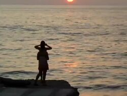 Two girlfriends dance and take photo of Mexican sunset 2 Stock Footage
