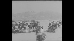 Refugees and UN troops leave Seoul during 1951 evacuation News Clip