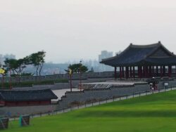WS T/L View of walking people at Fortified Wall of Yeonmudae ancient military training center in Suwon Hwaseong Castle (UNESCO) / Suwon, Gyeonggi-do, South Korea  Stock Footage