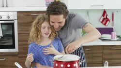 father and daughter cooking Stock Footage