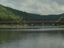  WS Bridge over river destroying with explosives / Foxburg, Pennsylvania, USA Stock Footage