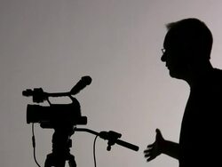 Two Cameramen; Videographers Work, Share Camera, Directs; Silhouette Stock Footage