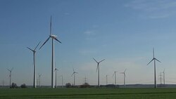 Wind turbines spin to produce electricity Stock Footage