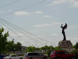 "Keeper of the Plains" native american statue with river and city park Stock Footage