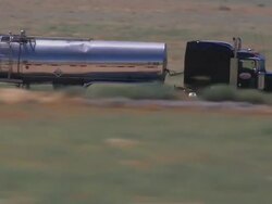 Aerial TS CU LA fuel tanker on road / Mojave Desert, California, United States. Stock Footage