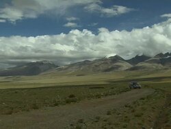 Wide Shot Car reaching Mansarovar Lake Lhasa Tibet China Stock Footage