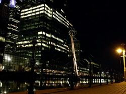 WS  athlete running towards camera in urban environment at night Stock Footage