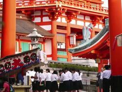   MS Shot of female high school students who are visiting Fushimi Inari Taisha by school trip / Fushimi ku, Kyoto, Japan. Stock Footage