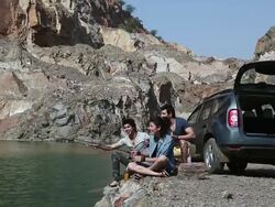 Friends fishing at riverbank, Haryana, India Stock Footage