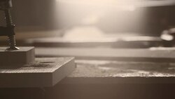 Wooden plank falling down on table in workshop Stock Footage
