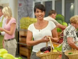 HD: Portrait Of A Happy Woman In Grocery Store Stock Footage