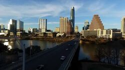 Aerial Drone Flight Over Austin Hovering Above South Congress Avenue Bridge with Deep Perspective of Texas State Capital and Skyline View Stock Footage
