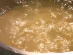 Woman's hand mixing spaghetti in the boiling water Stock Footage