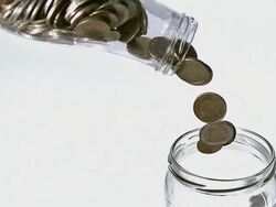 MS SLO MO Euro coins falling in bottle against white background / Vieux Pont, Normandy, France  Stock Footage