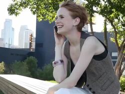 MS Young girl using cellular device outside in urban park smiling and having fun / Minneapolis, Minnesota, United States Stock Footage