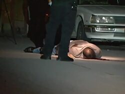 MS TD TU Shot of Mexican CSI and army examine dead gun shot victim at crime scene AUDIO / Ciudad Juarez, Juarez, Mexico Stock Footage
