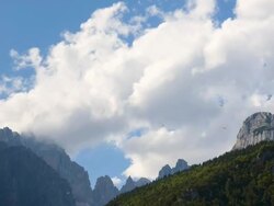 WS T/L Shot of Paragliders circling at alpine mountain peaks "Dolomiti di Brenta" / Molveno, Trentino, Italy Stock Footage