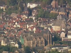 MS AERIAL Shot of St. Elizabeth Church and Marburg castle with other houses / Germany Stock Footage