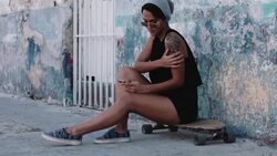 Urban skate girl with smart phone in street Stock Footage