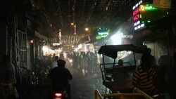 A decorated crowed street of Old Delhi, right outside the main entry gate of Jama Masjid just before dawn Stock Footage