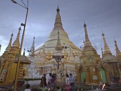 WS TD View of Men and women taking water and pouring it over Buddha statue in front of temples / Yangon, Yangon Division, Myanmar  Stock Footage