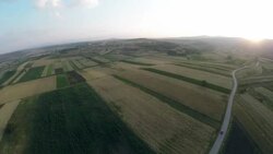 Aerial panorama over green fields farms summer Stock Footage