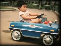 60's 8mm footage - Boy playing with a toy car Stock Footage