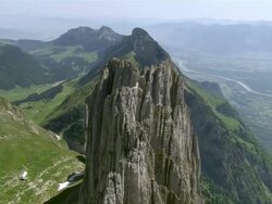 WS AERIAL View of summits of Kreuzberge Mountains in alpstein with view on roslenalp and Rhine Valley / Kreuzberge, St. Gallen, Switzerland Stock Footage