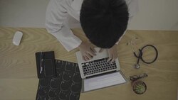 Medical staff examine x-ray in overhead angle Stock Footage