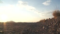 A safari jeeps drives through the Namib Desert at golden hour. Stock Footage