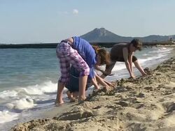 MS Shot of children playing at beach in holiday / Puerto Pollenca, Mallorca, Balearic Islands, Spain Stock Footage