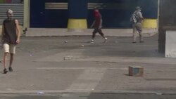 CLEAN : Honduras police fire teargas at protesters as Hernandez sworn in News Clip