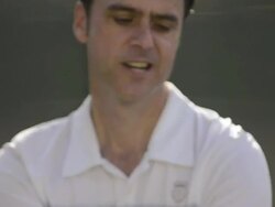 ECU of a man serving a tennis ball and talking smack. Stock Footage